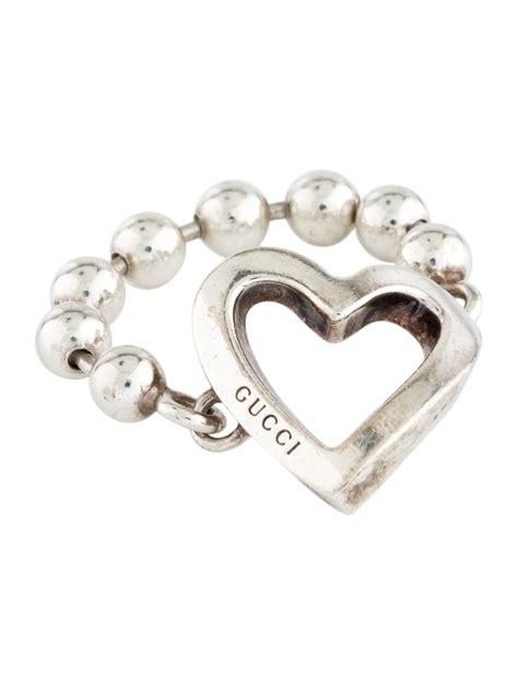 gucci heart ring on hand